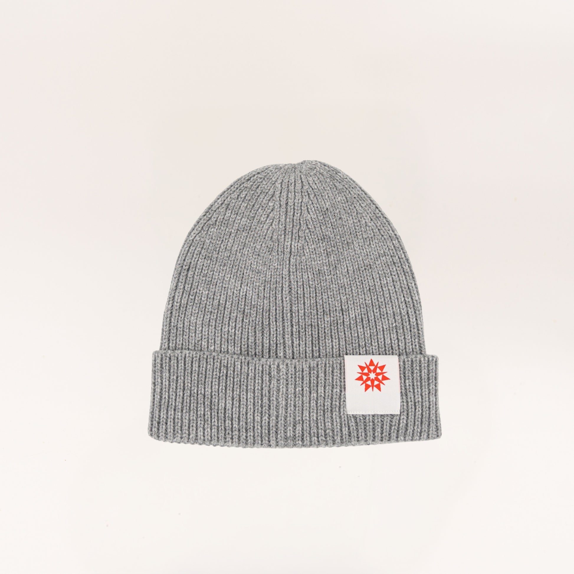 Light grey knit recycled cuffed beanie with Higher grounds Logo patch 